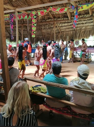 Tourists watching Embera dance during a tour